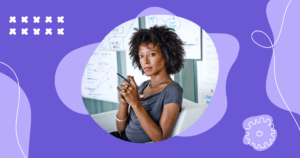 a woman planning content with screens behind her